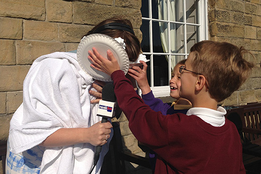 Becky from Peak FM getting a custard pie in the face